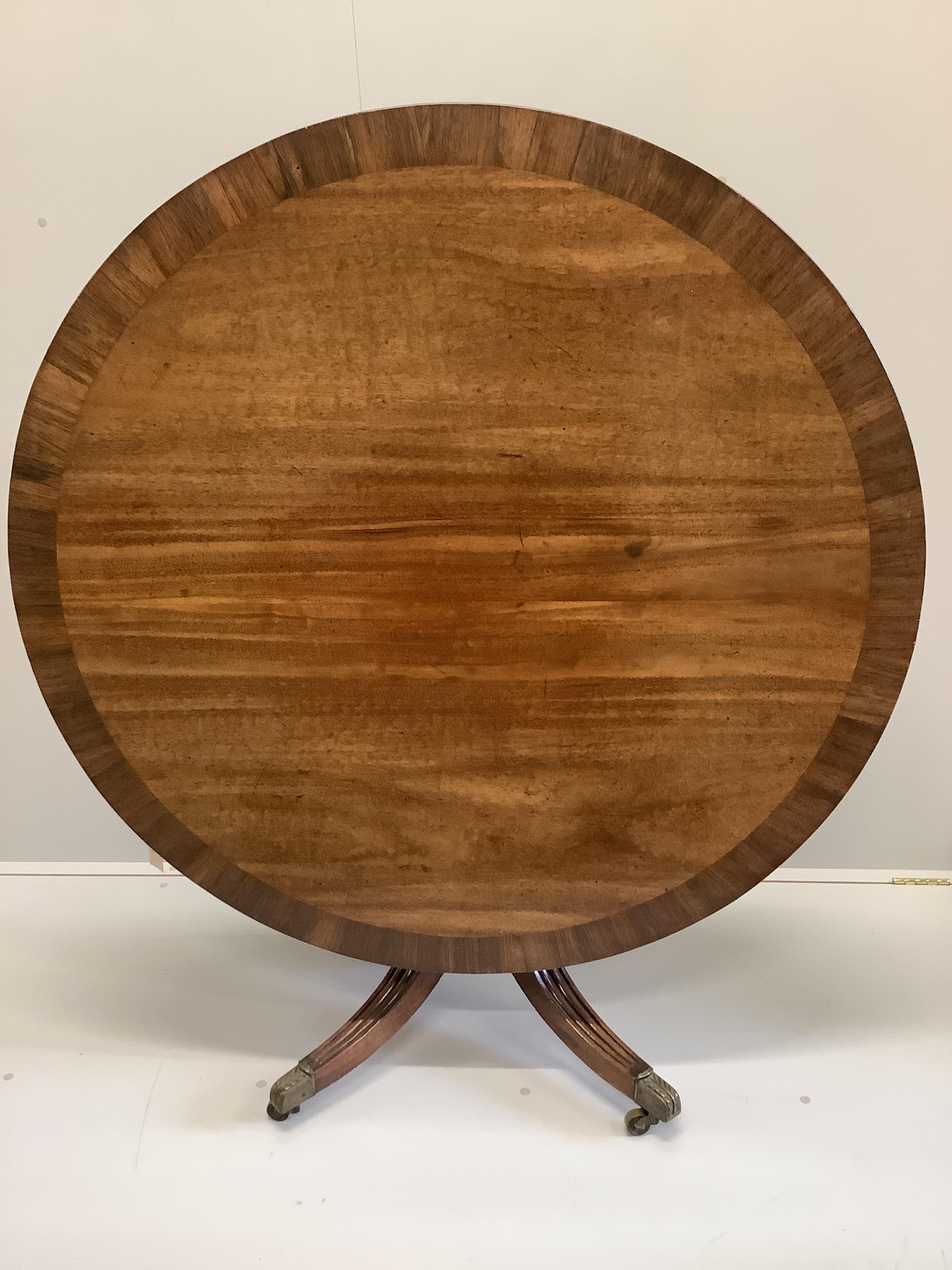 A Regency rosewood banded circular mahogany tilt top breakfast table, diameter 123cm, height 75cm
